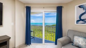 a living room with a view of the ocean at Coastal Joy 3412 Ocean Pointe in Tavernier