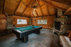 a large room with a pool table in a cabin at ANTON Tenczyn in Tenczyn