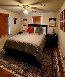 a bedroom with a large bed with two pillows at Ambervine in Lowell