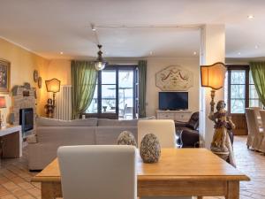 a living room with a couch and a table at Villa Oleandra sul Lago by Interhome in San Feliciano