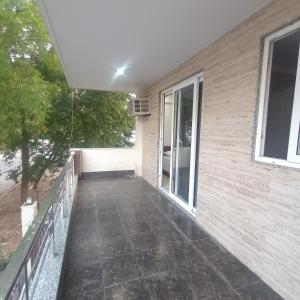 a balcony of a house with a window at Palam residency pg in Gurgaon