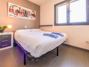 a large bed in a room with a window at Holiday Home La Barca by Interhome in Cambrils