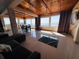 a living room with a couch and a table at Bird House in Krimovice