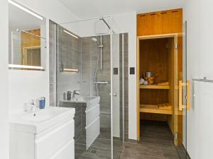 a bathroom with a shower and a sink at Holiday Home Haus Schmidt - 305 by Interhome in Lembruch