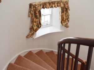 a stairway with a window and a stair case at Castle Peroch-Uk5698 in Logierait