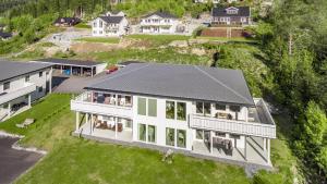 an aerial view of a large white house at Kvitefjell 35 in Loen