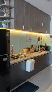 a kitchen with a sink and a toilet in it at SOHA House in Rạch Giá