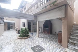 an open courtyard with a staircase in a building at Guest House Central in Florianópolis