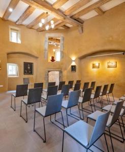 a room with a bunch of chairs in it at Gut Junkernhof in Calden