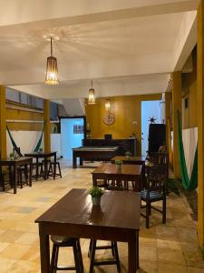 a living room with tables and a pool table at Praia Jeri House in Jericoacoara