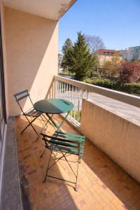 two chairs and a table on a balcony at M031 Joli t3 centre d'Annemasse in Annemasse