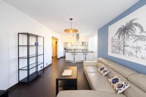 a living room with a couch and a table at M031 Joli t3 centre d'Annemasse in Annemasse
