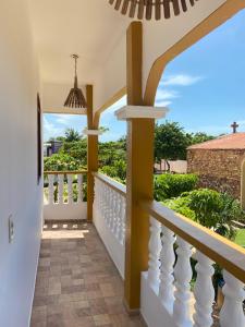 a home with a balcony with a view of the ocean at Praia Jeri House in Jericoacoara
