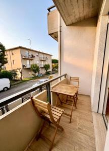 a balcony with two chairs and a table at The Sea Pearl Suite in Punta Marina