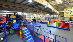 a play room with many different types of play equipment at Hotel Galaxie in Zlín