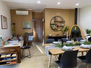 a living room with a table and a dining room at Villa Lavinia in Alghero