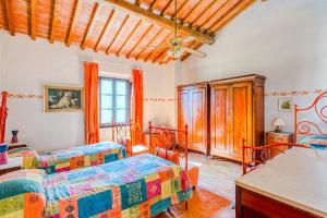 a bedroom with two beds in a room at Agriturismo Girasole in Gambassi Terme +111 photos