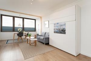 a living room with a couch and a table at Marina Wendtorf Oase in Wendtorf