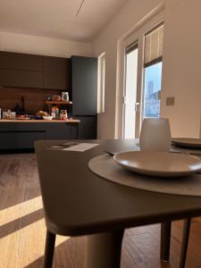 a kitchen with a table with a laptop on it at Mood Valentina in Goriano Sicoli