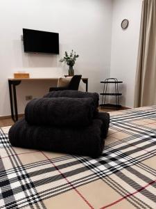 a room with a pile of blankets on the floor at Mood Valentina in Goriano Sicoli