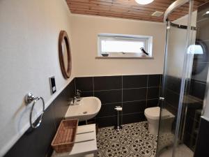 a bathroom with a sink and a toilet and a shower at March Brown in Garmouth