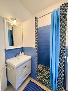a bathroom with a sink and a shower at The Sea Pearl Suite in Punta Marina