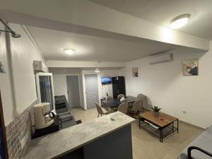 a large living room with a kitchen and a living room at NOMADIA MOUSSa in Pamandzi