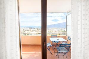 a view of a balcony with a table and chairs at M046 T3 cosy 2 chambres et balcon in Ambilly