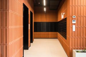 an empty locker room with a bunch of wine racks at Prime Apartments Gdańsk in Gdańsk