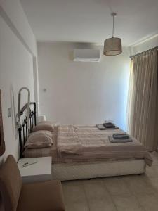 a bedroom with a bed and a couch at Sesta Home Cyprus in Kalecik +15 photos