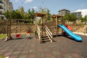 a playground with a slide and a slideintend at ARCADIA Homes in Alanya