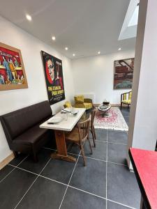 a living room with a table and a couch at Le loft - hypercentre de Tours in Tours