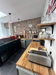 a kitchen with a counter with a toaster on a table at Le loft - hypercentre de Tours in Tours