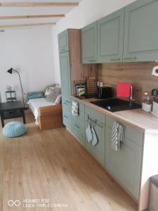 a kitchen with a sink and a counter top at Ferienwohnung am Schlosspark in Potsdam