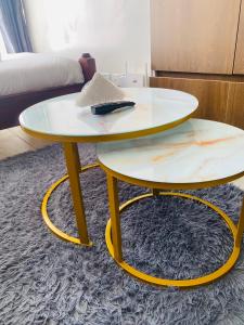 two tables with surfboards on top of them on a rug at Tripstar villa studio at Tsavo sunset Kiambu Road Thindigua in Kiambu