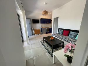 a living room with a couch and a table at Shaunagh's Place in Kalymnos