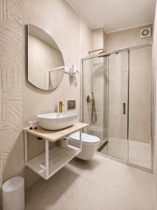 a bathroom with a sink and a shower at Pensiunea Brici in Cluj-Napoca