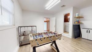 a room with a wooden bench in the middle at Waterfront oasis 3BR Game Room Pet Friendly in Little Egg Harbor Township