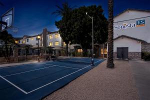 a tennis court in front of a building at Sonesta ES Suites Phoenix Goodyear in Goodyear