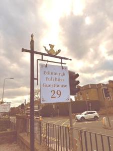 a sign on a street with a traffic light at Edinburgh full bliss in Edinburgh