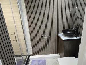 a bathroom with a sink and a glass shower at Levy Nook 6 in Darlington +5 photos