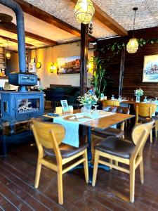 a restaurant with a table and chairs and a stove at Villa Siesta Hotel Istanbul Airport in Karaburun
