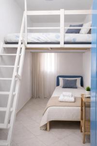 a bedroom with two bunk beds and a ladder at A Mare in Vasto