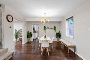 a dining room with a table and chairs at Sun-Filled and Spacious One-Level Buckhead Oasis in Atlanta