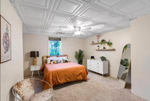 a bedroom with a bed and a white ceiling at Sun-Filled and Spacious One-Level Buckhead Oasis in Atlanta