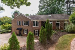 a brick house with a driveway at Sun-Filled and Spacious One-Level Buckhead Oasis in Atlanta