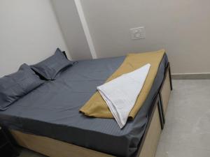 a bed with a pillow on it in a room at sea shore stays in Rushikonda