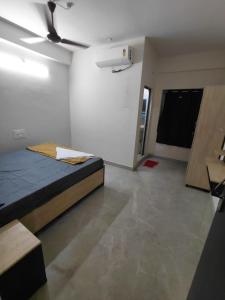 a bedroom with a bed in a room at sea shore stays in Rushikonda