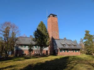 an old brick building with a tower on top of it at Turmhütte in Lauterbach