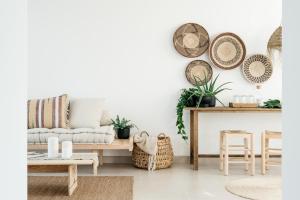 a living room with a couch and a table at O Lugar in Porto Covo